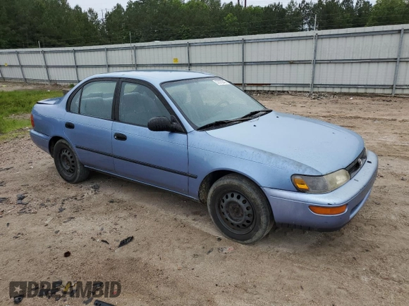 1995 Toyota Corolla DX with VIN 2T1AE09B5SC127586, listed as a Copart auction lot 57075045 with 244,969 mi miles and Salvage title. Bid and sale history available at DreamBid. Image 4.