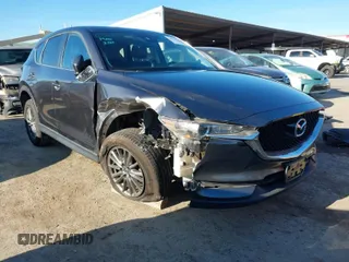 2017 Mazda CX-5 Touring with VIN JM3KFBCL2H0165625, listed as a IAAI auction lot 41879145 with 64,745 mi miles. Bid and sale history available at carsss.com. Image 1.