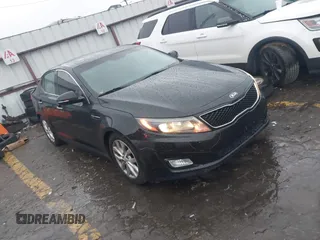 2015 Kia Optima EX with VIN 5XXGN4A73FG413993, listed as a IAAI auction lot 41536587 with 195,670 mi miles. Bid and sale history available at carsss.com. Image 1.