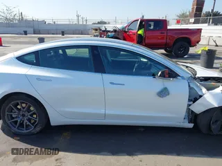 2019 Tesla Model 3 Long Range with VIN 5YJ3E1EB1KF510912, listed as a IAAI auction lot 41857775 with Not Provided miles and . Bid and sale history available at DreamBid. Image 13.