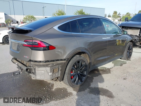 2016 Tesla Model X P90D with VIN 5YJXCAE45GF000773, listed as a IAAI auction lot 42052642 with 127,670 mi miles. Bid and sale history available at carsss.com. Image 4.