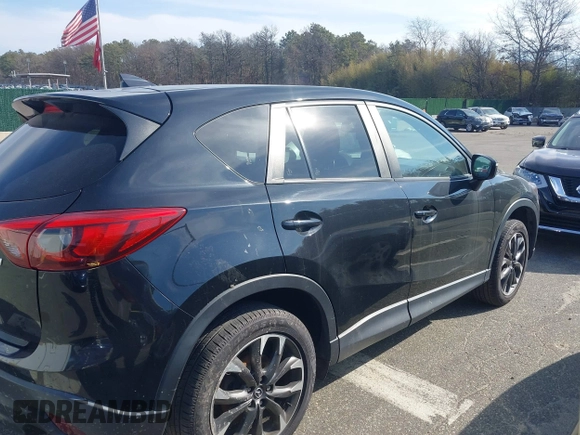 2016 Mazda CX-5 Grand Touring with VIN JM3KE4DY5G0681436, listed as a IAAI auction lot 41664780 with 172,199 mi miles. Bid and sale history available at carsss.com. Image 13.