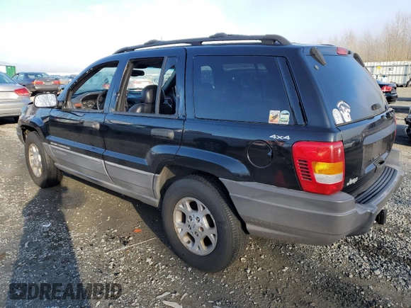 1999 Jeep Grand Cherokee Laredo z VIN 1J4GW58N1XC737706, wystawiony jako Copart lot #83107914 z przebiegiem Nie podano mil oraz Szkoda całkowita • Salvage title. Historia ofert i sprzedaży dostępna na DreamBid. Obrazek 2.