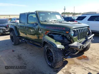 2022 Jeep Gladiator Mojave with VIN 1C6JJTEG5NL110886, listed as a IAAI auction lot 41410576 with 44,307 mi miles and . Bid and sale history available at DreamBid. Image 1.
