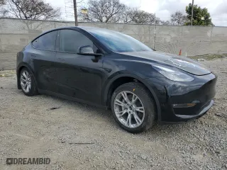 2023 Tesla Model Y Long Range with VIN 7SAYGAEE5PF880779, listed as a Copart auction lot 50777585 with 22,135 mi miles and Salvage Title. Bid and sale history available at carsss.com. Image 4.