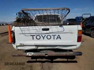 1991 Toyota Pickup DLX z VIN JT4VN13D4M5065504, wystawiony jako Copart lot #54058595 z przebiegiem 108 782 mil mil oraz Tytuł czysty. Historia ofert i sprzedaży dostępna na DreamBid. Obrazek 6.