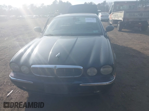 2004 Jaguar XJ with VIN SAJWA71C74SG22814, listed as a IAAI auction lot 41649399 with 114,841 mi miles. Bid and sale history available at carsss.com. Image 6.