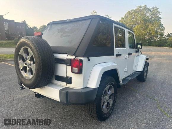 2016 Jeep Wrangler Unlimited Sahara with VIN 1C4BJWEG5GL215915, listed as a Copart auction lot 61690145 with 143,925 mi miles and Clean title. Bid and sale history available at DreamBid. Image 4.