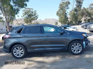 2020 Ford Edge Titanium with VIN 2FMPK3K94LBB10568, listed as a IAAI auction lot 42430196 with 76,490 mi miles and . Bid and sale history available at DreamBid. Image 14.