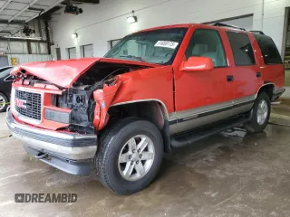 1999 GMC Yukon with VIN 1GKEK13R1XJ711537, listed as a Copart auction lot 51658175 with 228,786 mi miles and Salvage Title. Bid and sale history available at carsss.com. Image 1.