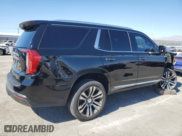 2021 GMC Yukon SLT with VIN 1GKS1BKDXMR119990, listed as a Copart auction lot 74733094 with 73,597 mi miles and Salvage Title. Bid and sale history available at carsss.com. Image 3.