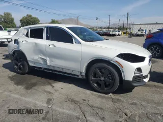 2018 BMW X2 sDrive28i with VIN WBXYJ3C34JEJ84163, listed as a Copart auction lot 54043904 with 46,509 mi miles and Salvage title. Bid and sale history available at DreamBid. Image 4.