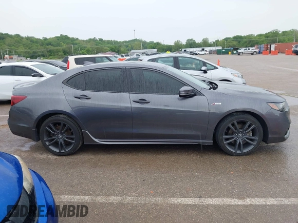 2019 Acura TLX w/A-Spec Pkg z VIN 19UUB2F61KA000932, wystawiony jako IAAI lot #42164064 z przebiegiem 79 080 mil mil oraz . Historia ofert i sprzedaży dostępna na DreamBid. Obrazek 13.