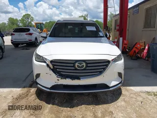 2016 Mazda CX-9 Grand Touring with VIN JM3TCADYXG0113563, listed as a IAAI auction lot 42593120 with 237,696 mi miles and . Bid and sale history available at DreamBid. Image 6.