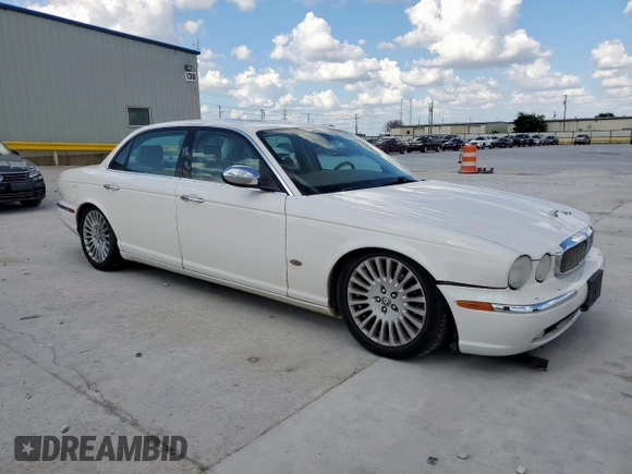 2006 Jaguar XJ Vanden Plas with VIN SAJWA82B16SH06996, listed as a Copart auction lot 62509025 with 80,236 mi miles and Salvage title. Bid and sale history available at DreamBid. Image 4.