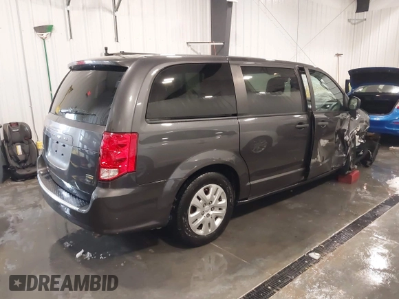 2019 Dodge Grand Caravan SE with VIN 2C4RDGBG9KR527770, listed as a IAAI auction lot 41571473 with 101,310 mi miles and . Bid and sale history available at DreamBid. Image 4.
