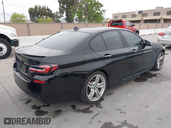2014 BMW 5 Series 535d with VIN WBAXA5C59ED690375, listed as a IAAI auction lot 42030902 with 70,553 mi miles and . Bid and sale history available at carsss.com. Image 4.