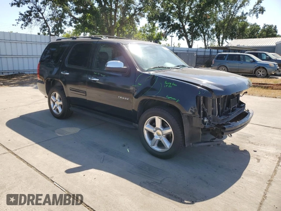 2014 Chevrolet Tahoe LT with VIN 1GNSCBE07ER115998, listed as a Copart auction lot 59577485 with 154,486 mi miles and Salvage title. Bid and sale history available at DreamBid. Image 4.