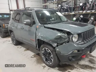 2016 Jeep Renegade Trailhawk z VIN ZACCJBCT0GPC96556, wystawiony jako IAAI lot #41045119 z przebiegiem 86 736 mil mil oraz . Historia ofert i sprzedaży dostępna na DreamBid. Obrazek 1.