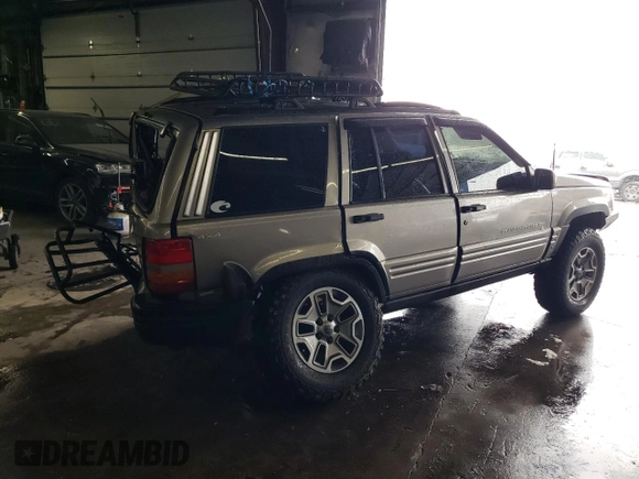 1998 Jeep Grand Cherokee Limited with VIN 1J4GZ78S9WC308708, listed as a Copart auction lot 79315694 with 205,976 mi miles and Salvage title. Bid and sale history available at DreamBid. Image 3.