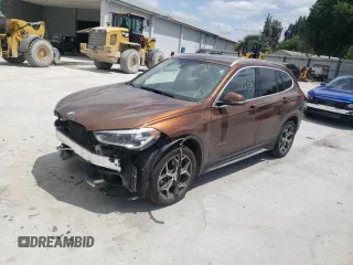 2016 BMW X1 xDrive28i with VIN WBXHT3C31GP880132, listed as a Copart auction lot 69129132 with 74,759 mi miles. Bid and sale history available at carsss.com. Image 2.