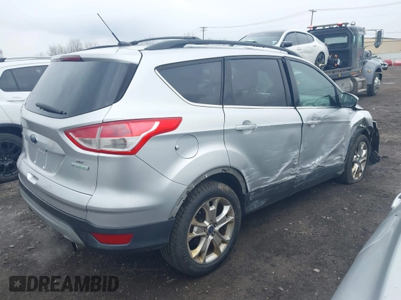 2013 Ford Escape SE with VIN 1FMCU0GX5DUA51847, listed as a IAAI auction lot 41897727 with 115,721 mi miles and . Bid and sale history available at DreamBid. Image 4.