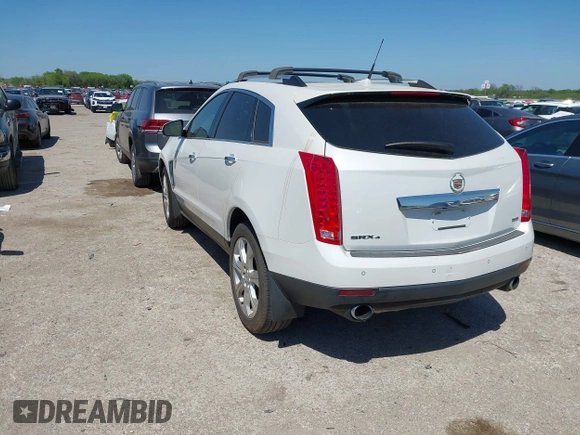 2014 Cadillac SRX Performance Collection with VIN 3GYFNFE35ES582897, listed as a IAAI auction lot 41978361 with 144,116 mi miles and . Bid and sale history available at DreamBid. Image 3.