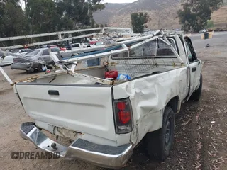 1989 Toyota Pickup DX с VIN JT4RN81P9K0023637, выставлен на аукционе IAAI как лот 42498482 с пробегом 218 937 миль миль и . История ставок и продаж доступна на DreamBid. Изображение 14.