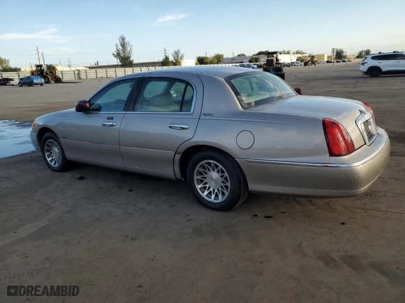1999 Lincoln Town Car Signature with VIN 1LNHM82W1XY710796, listed as a Copart auction lot 88077875 with 65,448 mi miles and Clean Title. Bid and sale history available at carsss.com. Image 2.