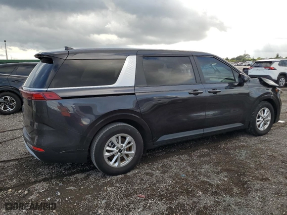2023 Kia Carnival LX with VIN KNDNB4H38P6255833, listed as a Copart auction lot 86990124 with 6,818 mi miles and Salvage Title. Bid and sale history available at carsss.com. Image 3.
