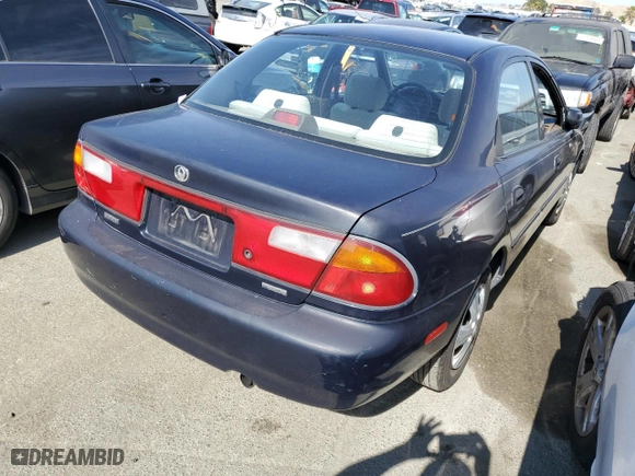 1997 Mazda Protege DX with VIN JM1BC1412V0157268, listed as a Copart auction lot 61380564 with 85,356 mi miles and Salvage Title. Bid and sale history available at carsss.com. Image 3.