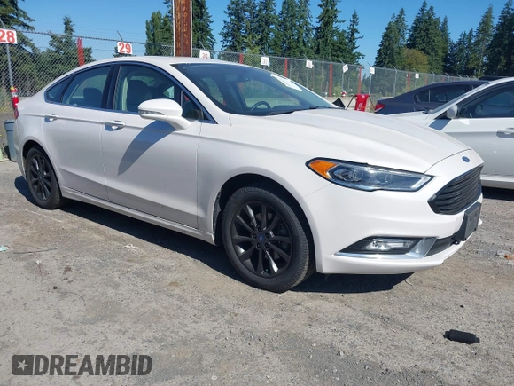 2017 Ford Fusion SE z VIN 3FA6P0HD3HR132779, wystawiony jako IAAI lot #42690212 z przebiegiem 165 293 mil mil oraz . Historia ofert i sprzedaży dostępna na DreamBid. Obrazek 1.