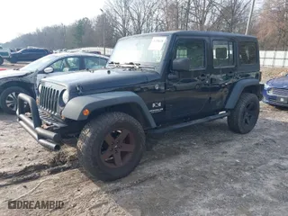 2008 Jeep Wrangler Unlimited X with VIN 1J4GA39148L648910, listed as a IAAI auction lot 41790678 with 93,528 mi miles. Bid and sale history available at carsss.com. Image 2.
