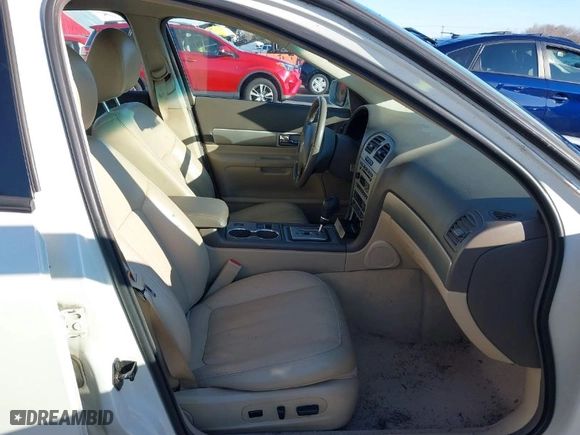 2005 Lincoln LS w/Sport Pkg with VIN 1LNHM87A65Y667891, listed as a IAAI auction lot 41297490 with 118,633 mi miles. Bid and sale history available at carsss.com. Image 5.