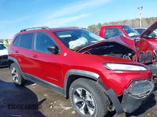2014 Jeep Cherokee Trailhawk with VIN 1C4PJMBS0EW257133, listed as a IAAI auction lot 41446095 with 82,285 mi miles and . Bid and sale history available at DreamBid. Image 13.