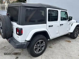 2023 Jeep Wrangler Sahara with VIN 1C4HJXENXPW586579, listed as a IAAI auction lot 41795621 with 34,433 mi miles. Bid and sale history available at carsss.com. Image 4.