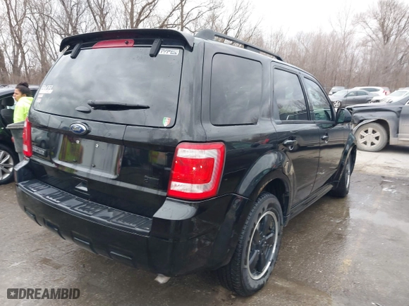 2011 Ford Escape XLT with VIN 1FMCU9DG7BKB03271, listed as a IAAI auction lot 41711731 with 139,135 mi miles. Bid and sale history available at carsss.com. Image 4.