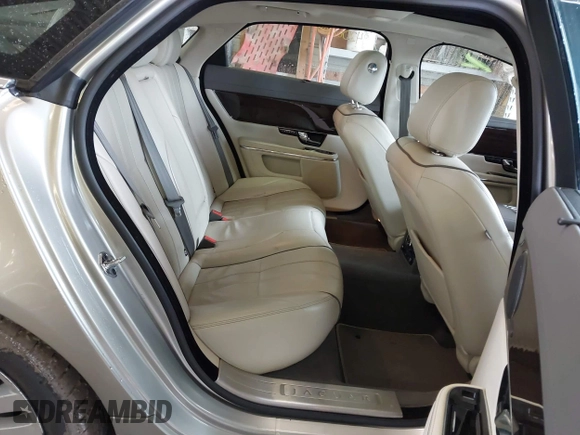 2013 Jaguar XJ Portfolio with VIN SAJWJ2GD0D8V50948, listed as a IAAI auction lot 42067884 with 110,053 mi miles and . Bid and sale history available at DreamBid. Image 8.