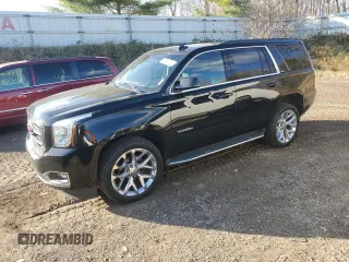 2019 GMC Yukon SLT Standard Edition with VIN 1GKS2DKC4KR391660, listed as a Copart auction lot 79744804 with 57,480 mi miles and Salvage Title. Bid and sale history available at carsss.com. Image 1.