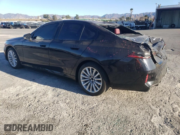 2024 BMW i5 eDrive40 with VIN WBY33FK03RCR92861, listed as a Copart auction lot 88443755 with 13,138 mi miles and Salvage title. Bid and sale history available at DreamBid. Image 2.