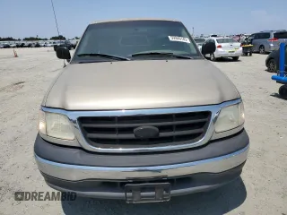 2000 Ford F-150 XL with VIN 1FTZF172XYNB65958, listed as a Copart auction lot 59946145 with 208,988 mi miles and Salvage title. Bid and sale history available at DreamBid. Image 5.