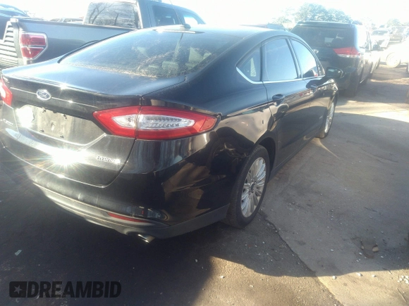 2015 Ford Fusion S Hybrid with VIN 3FA6P0UU9FR246868, listed as a IAAI auction lot 41307984 with 153,466 mi miles. Bid and sale history available at carsss.com. Image 4.