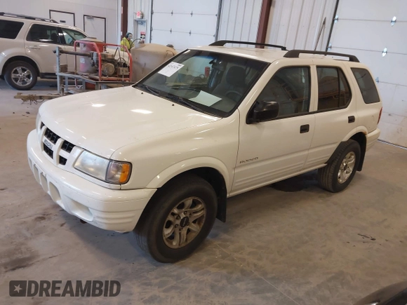 2004 Isuzu Rodeo S with VIN 4S2CK58W244313115, listed as a IAAI auction lot 42147475 with 186,594 mi miles and . Bid and sale history available at DreamBid. Image 2.
