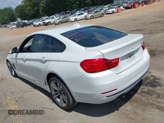 2015 BMW 4 Series 428i with VIN WBA4A5C56FG052023, listed as a IAAI auction lot 40085862 with 90,796 mi miles and . Bid and sale history available at carsss.com. Image 3.