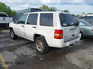1998 Jeep Grand Cherokee Limited with VIN 1J4GZ78Y2WC164021, listed as a IAAI auction lot 42109012 with 1 mi miles. Bid and sale history available at carsss.com. Image 3.