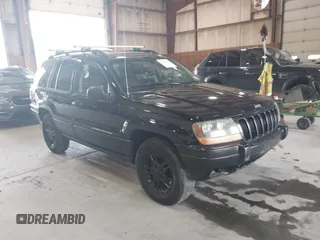 2002 Jeep Grand Cherokee Laredo with VIN 1J4GW48N42C168465, listed as a IAAI auction lot 42720232 with 249,044 mi miles and . Bid and sale history available at DreamBid. Image 1.
