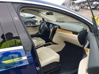 2018 Tesla Model X 75D with VIN 5YJXCAE2XJF111180, listed as a IAAI auction lot 41988079 with 114,593 mi miles and . Bid and sale history available at DreamBid. Image 5.