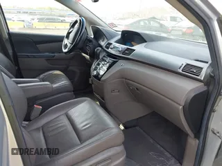 2011 Honda Odyssey EX-L with VIN 5FNRL5H61BB067456, listed as a IAAI auction lot 42131999 with 150,358 mi miles and . Bid and sale history available at carsss.com. Image 5.