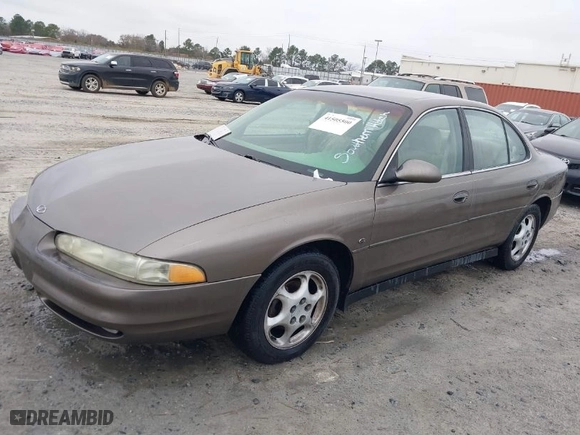 1999 Oldsmobile Intrigue GLS with VIN 1G3WX52H6XF321750, listed as a IAAI auction lot 41505500 with 180,036 mi miles. Bid and sale history available at carsss.com. Image 2.