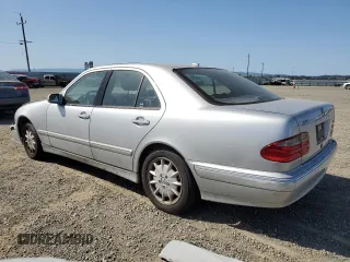 2000 Mercedes-Benz E-Class with VIN WDBJF65J4YB159268, listed as a Copart auction lot 50923115 with 127,650 mi miles and Salvage Title. Bid and sale history available at carsss.com. Image 2.